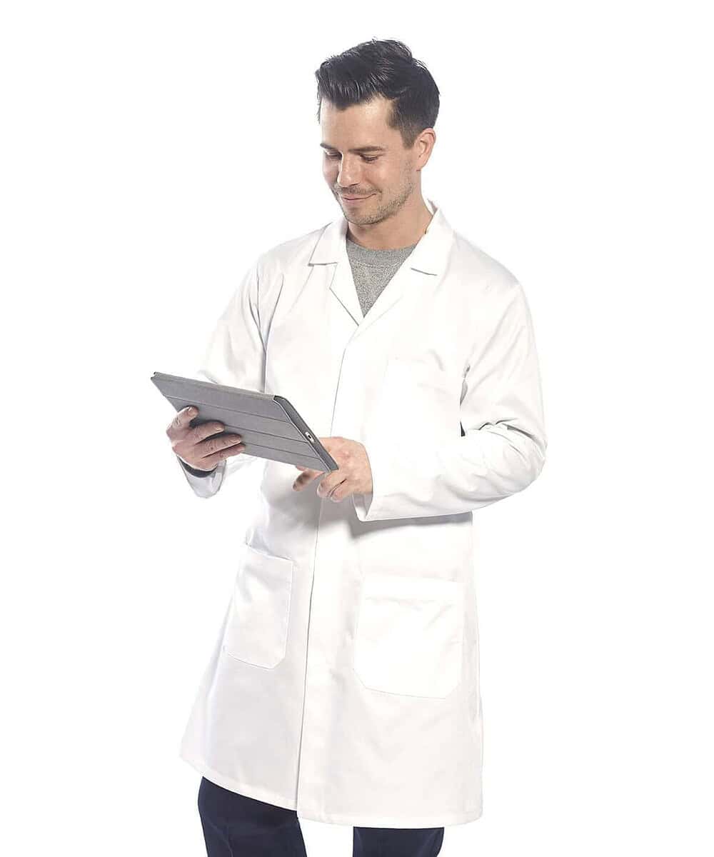 Man wearing a Portwest PW175 lab coat, holding a tablet, on a white background.
