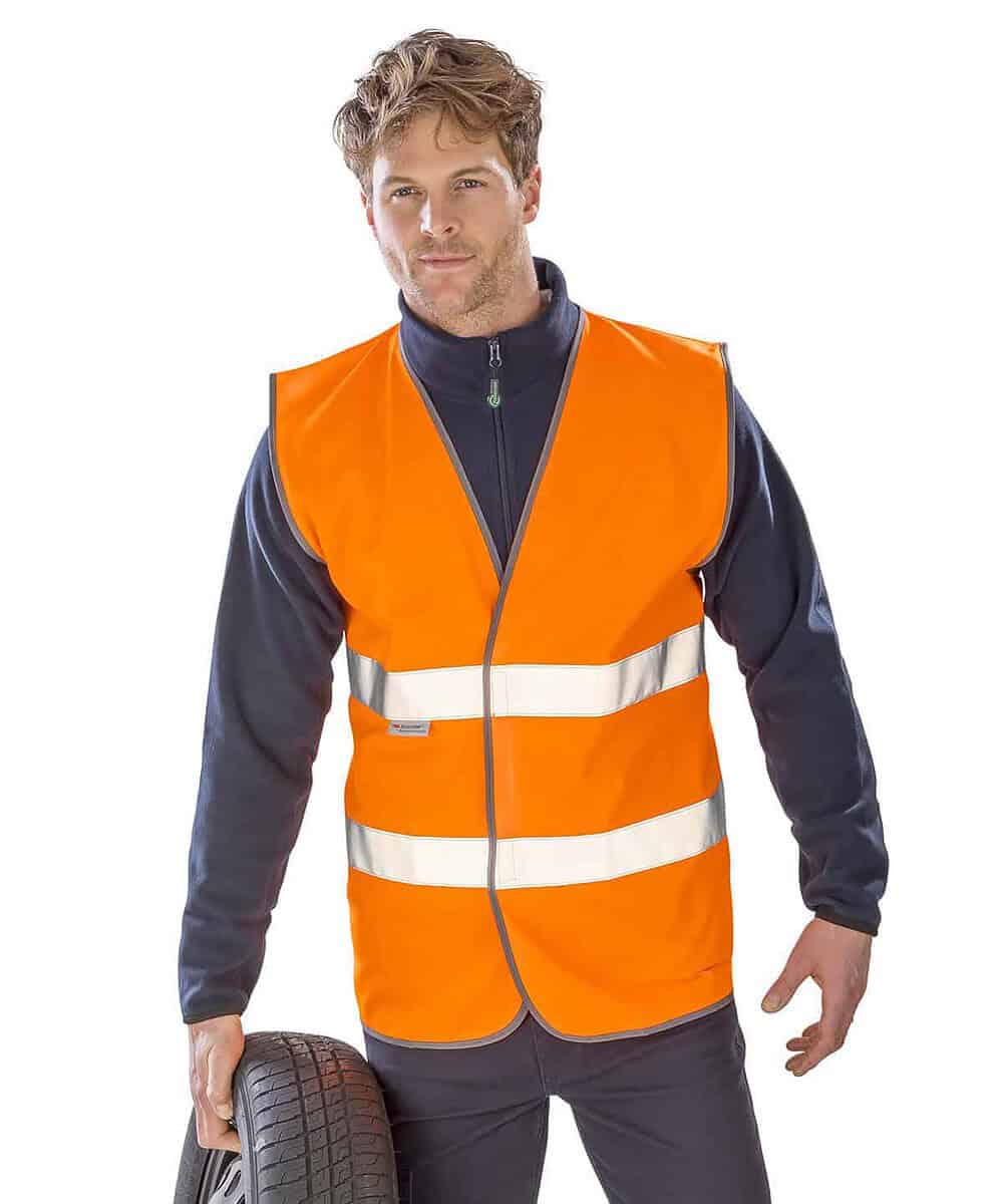 High-visibility personalised safety vest for motorists and workers. Bright orange with reflective st.