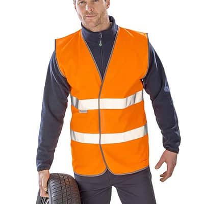 High-visibility personalised safety vest for motorists and workers. Bright orange with reflective st.