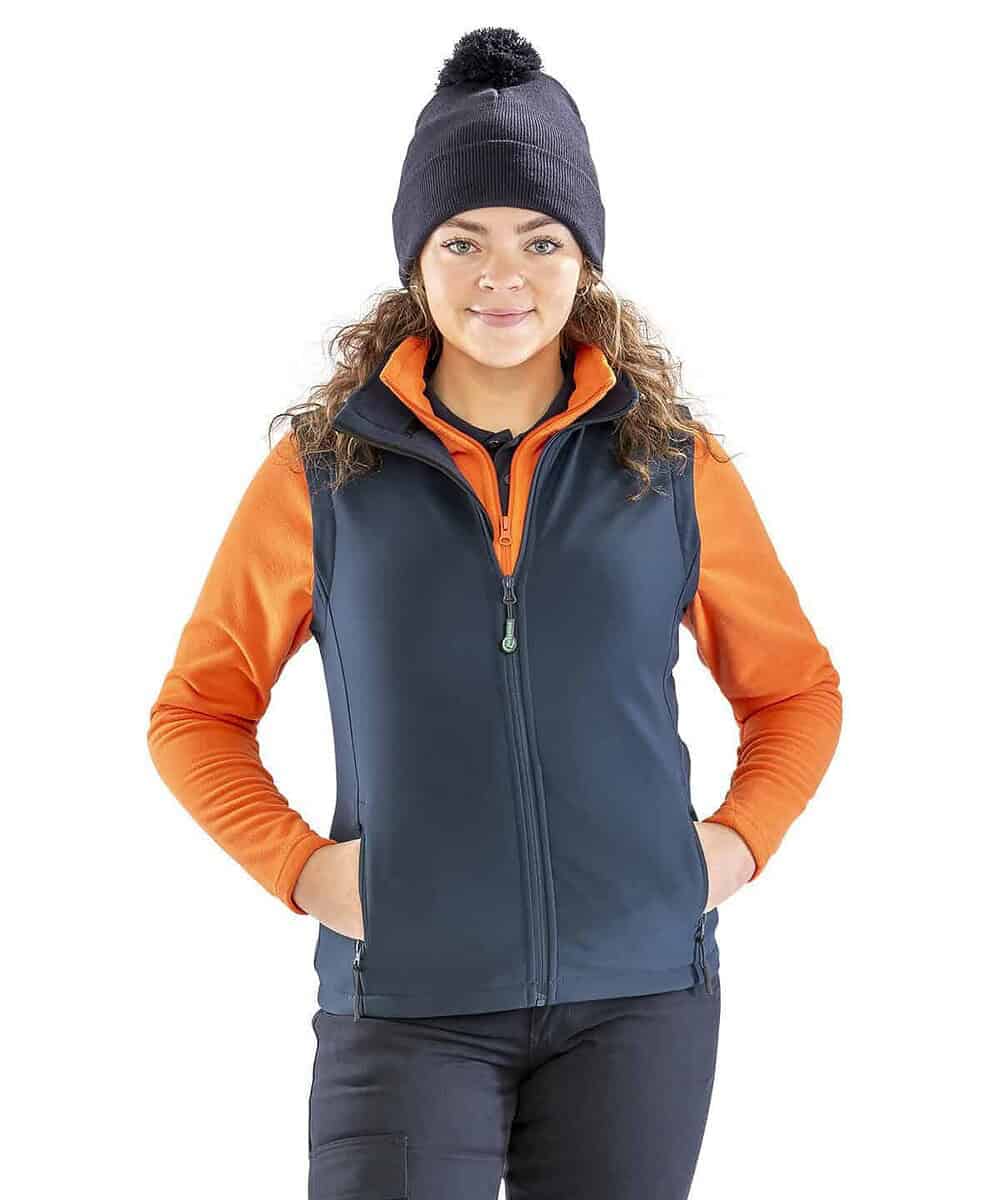 Women’s navy and orange softshell bodywarmer with personalised embroidery options. Perfect for workw.