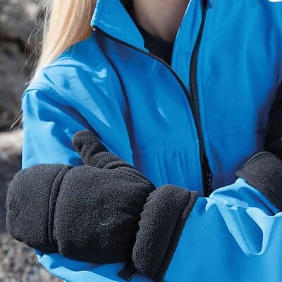 Close-up of personalised winter work gloves with logo embroidery, worn by a worker in outdoor gear.