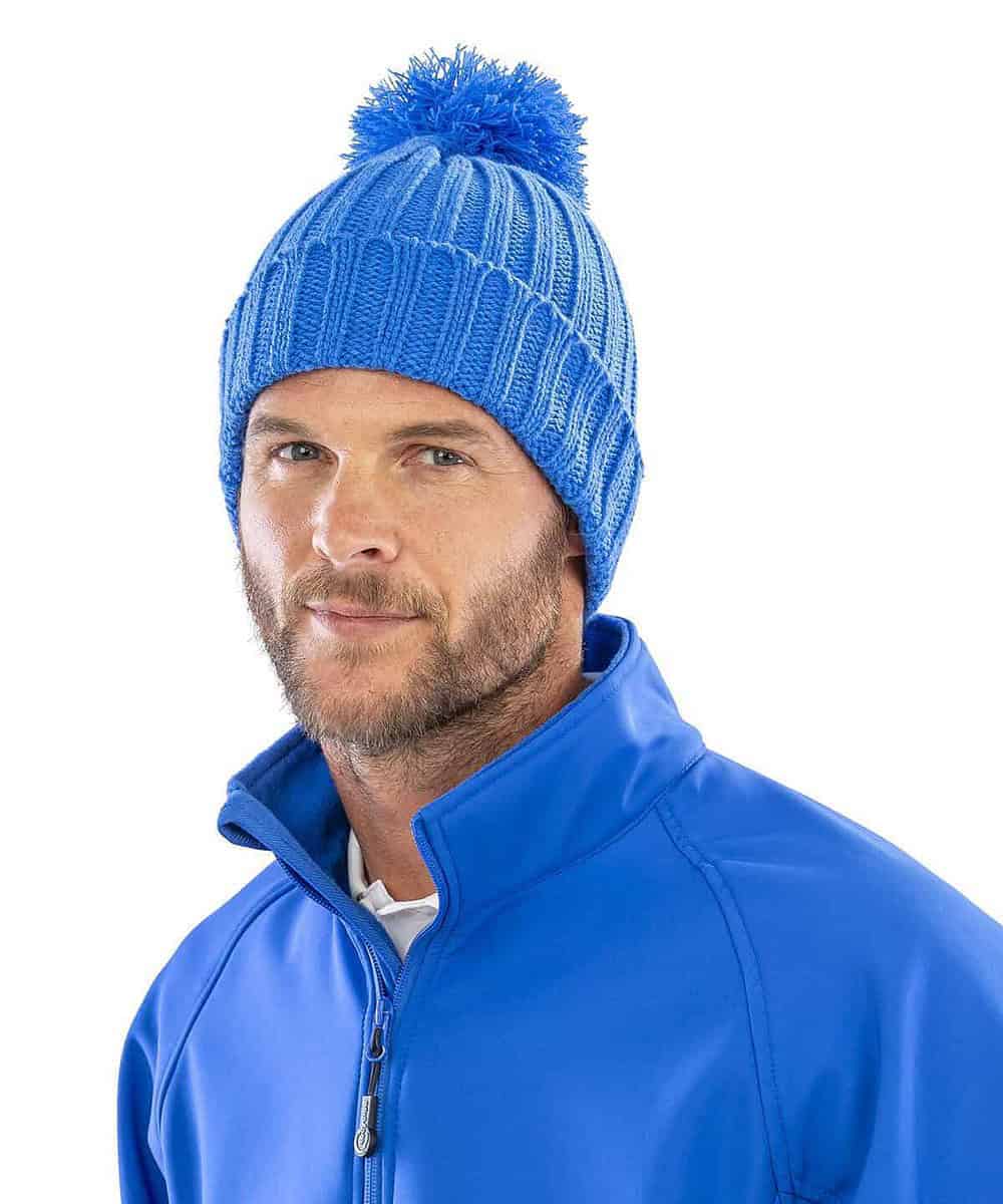 Embroidered blue knitted hat with pom-pom, perfect for winter workwear and personalised branding.