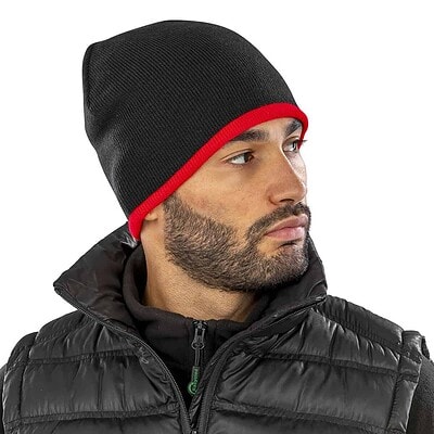 Reversible fashion fit hat in black with red trim, personalised with your logo for winter wear.
