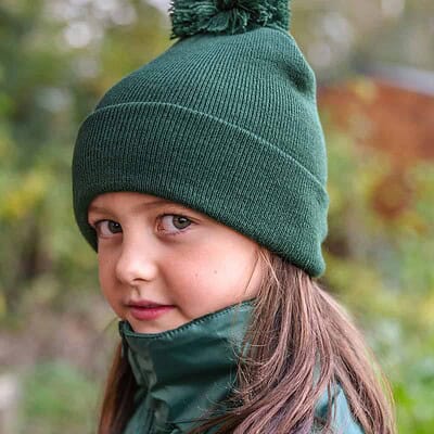 Embroidered winter beanie with pom pom, perfect for children, featuring space for custom logo embroi.