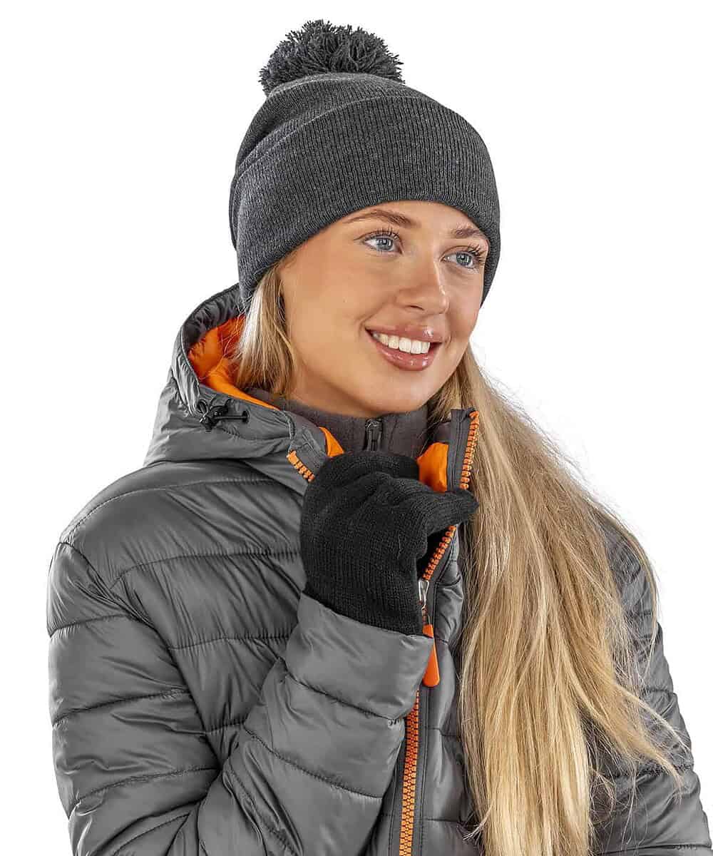 Embroidered winter beanie with pom pom, personalised with your logo for warmth and style.