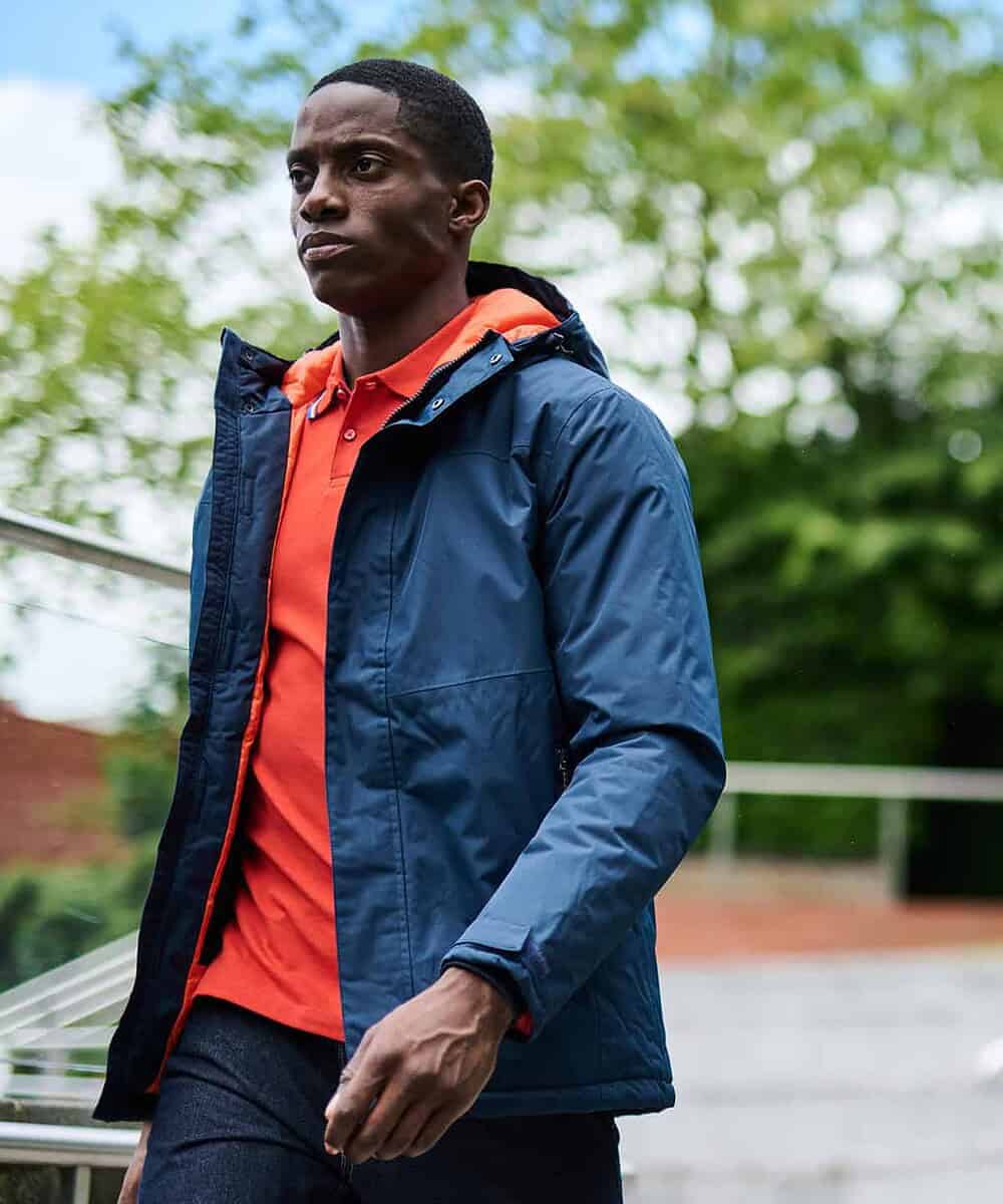 Man wearing Regatta Thermogen Powercell 5000 insulated heated jacket outdoors.