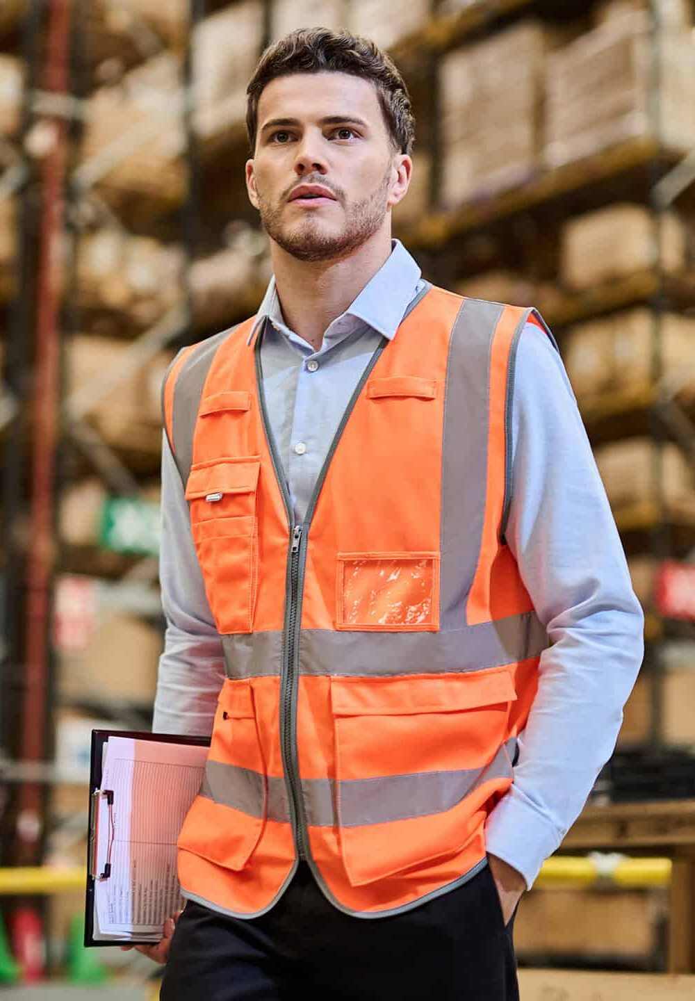 High-visibility orange safety workwear vest with reflective strips for industrial and construction jobs.