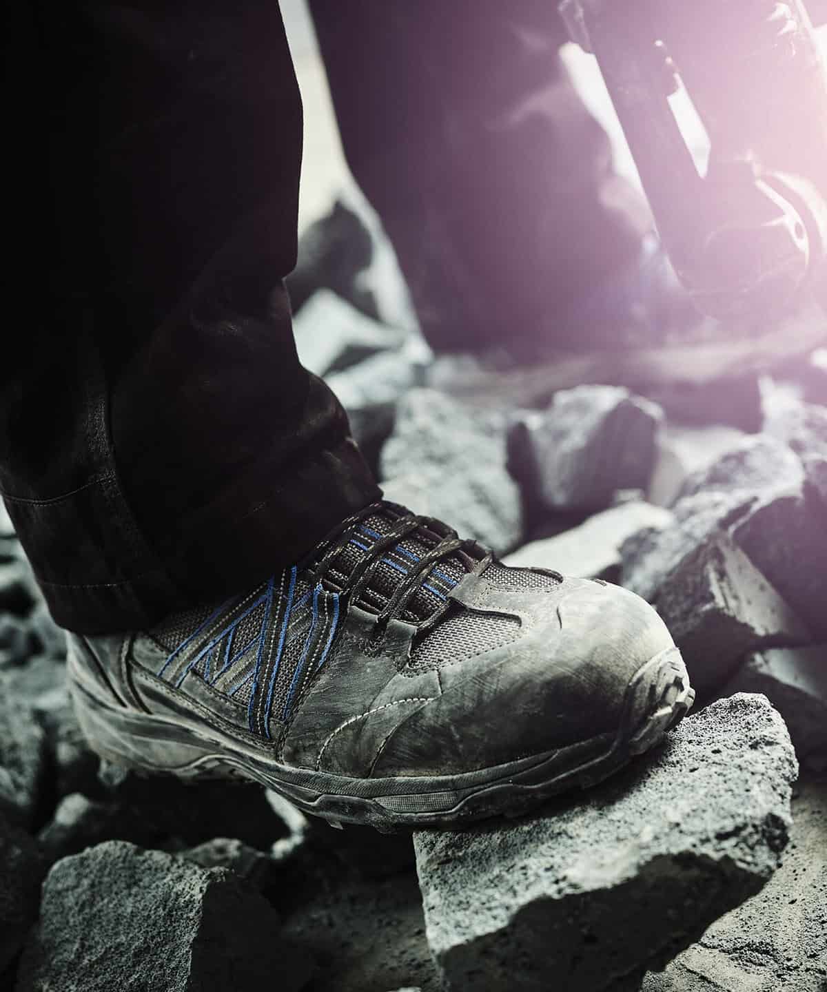 Workwear embroidery on sturdy safety footwear for construction and industrial workers.