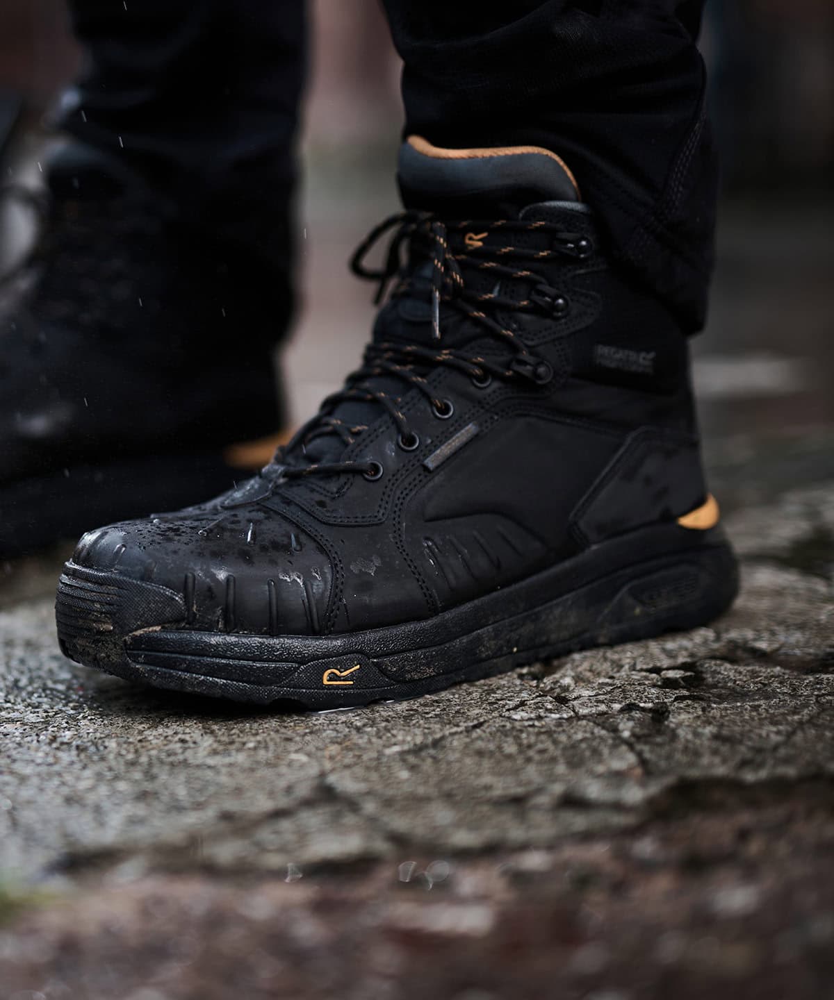 Waterproof black safety boots designed for workwear and personal protective equipment.