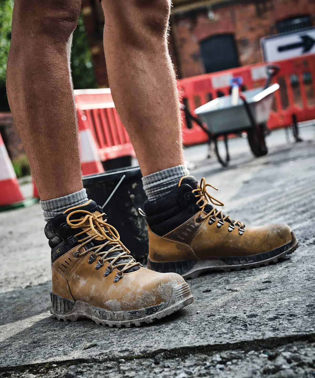 Steel toe work boots with safety features, suitable for construction sites and industrial work.