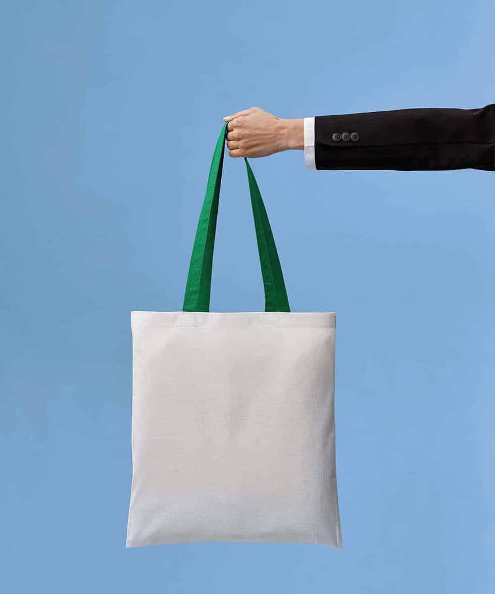 Cotton shopper bag with green handles, ideal for teamwear and promotional use.