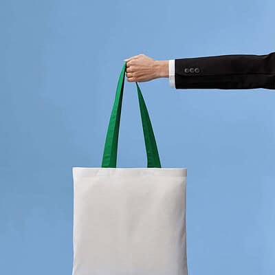 Cotton shopper bag with green handles, ideal for teamwear and promotional use.