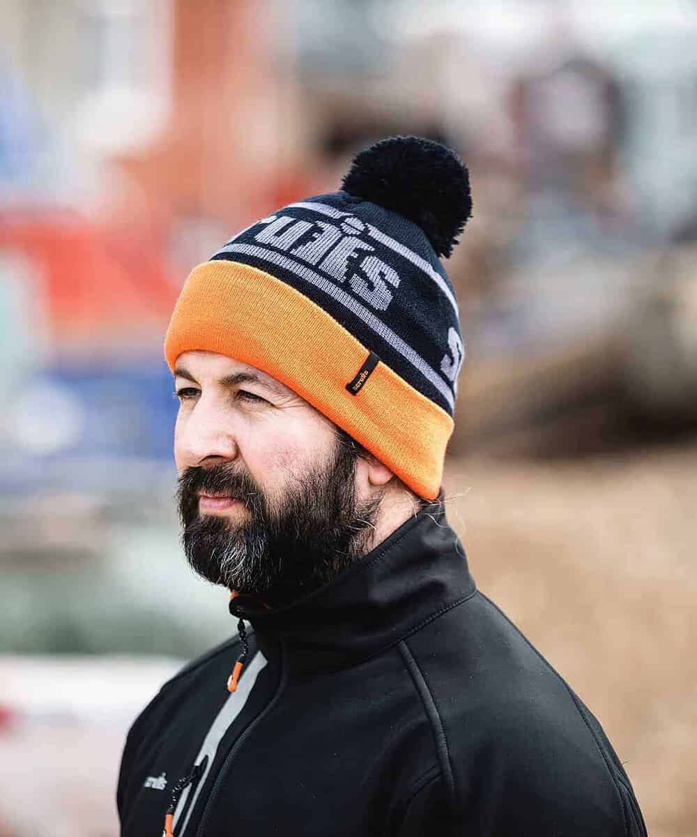Trade Bobble Hat with embroidered logo in black and orange.