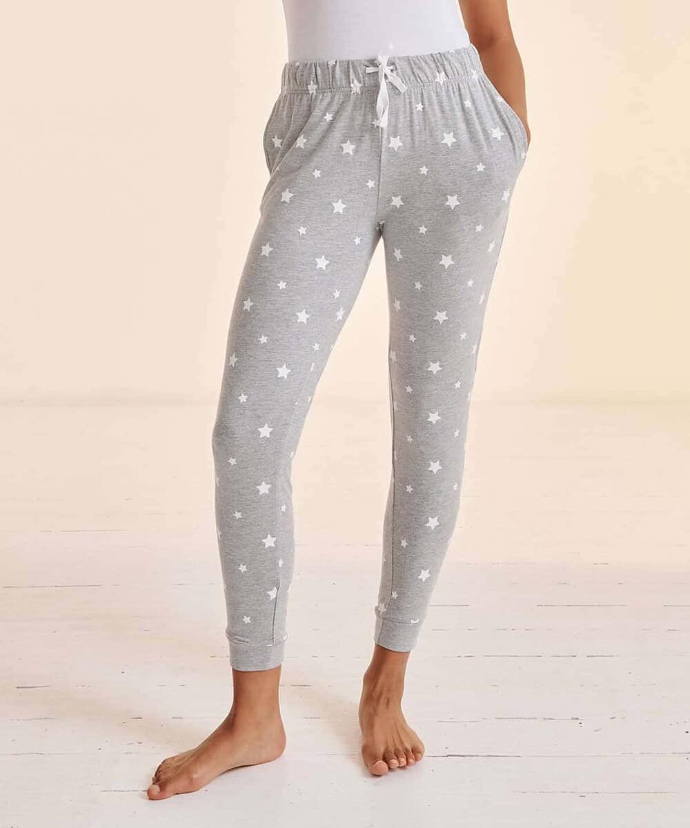 Grey women's cuffed lounge pants with star print and drawstring waist.