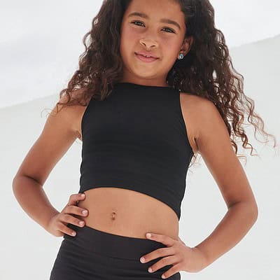 Child wearing a black cropped top with embroidered logo for branding.