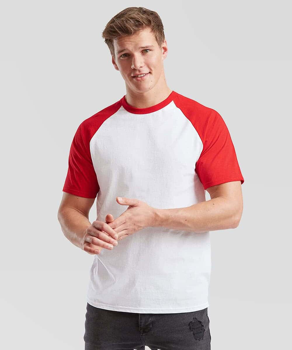 Man wearing a Fruit Of The Loom SS026 short sleeve baseball T-shirt in white with red sleeves.