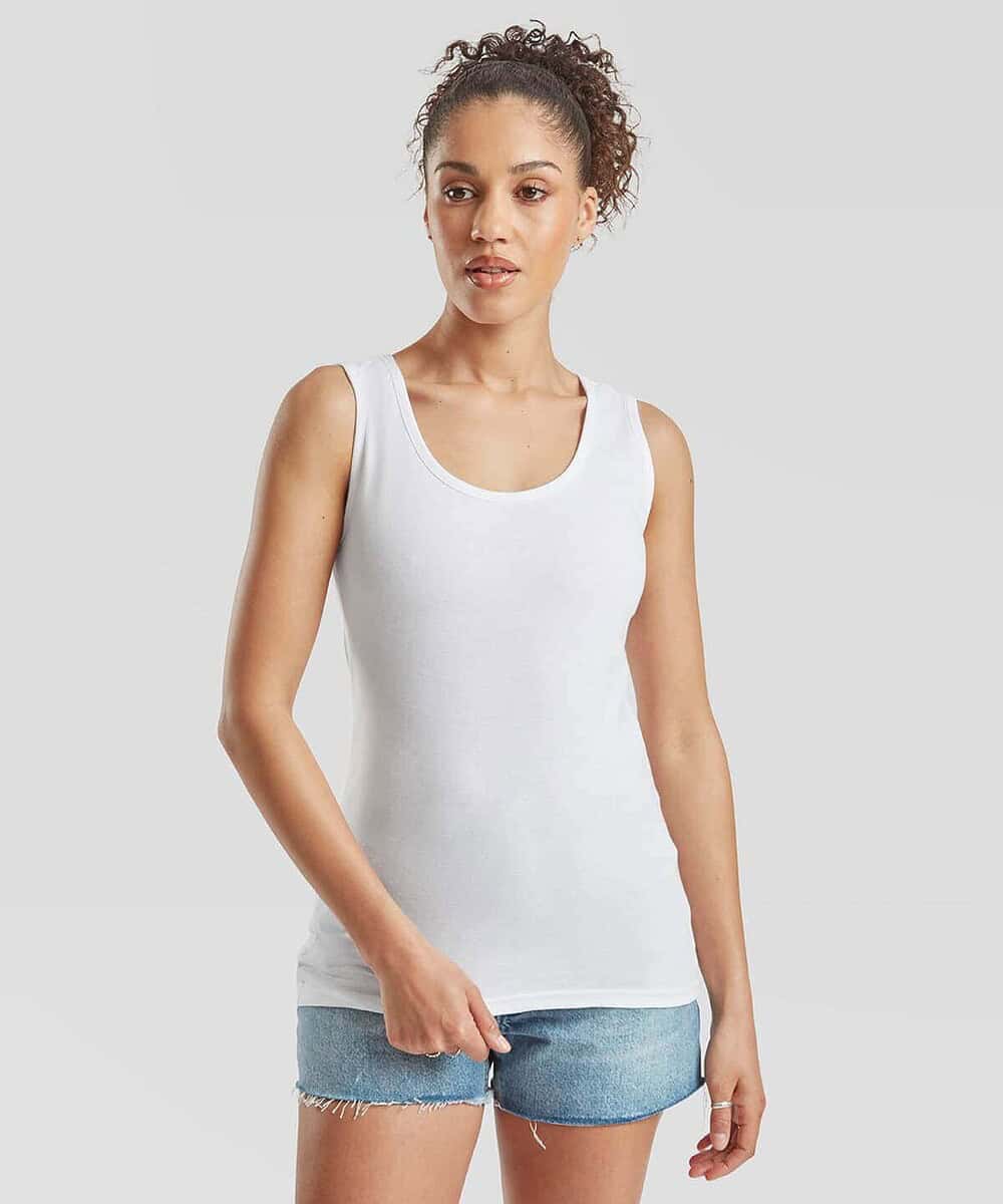 Woman wearing a white Fruit Of The Loom women's vest, ideal for work uniforms and casual teamwear.