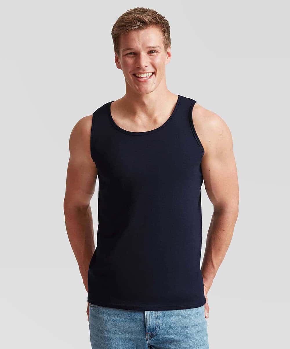 Man wearing navy athletic vest, ideal for workwear and team uniforms.