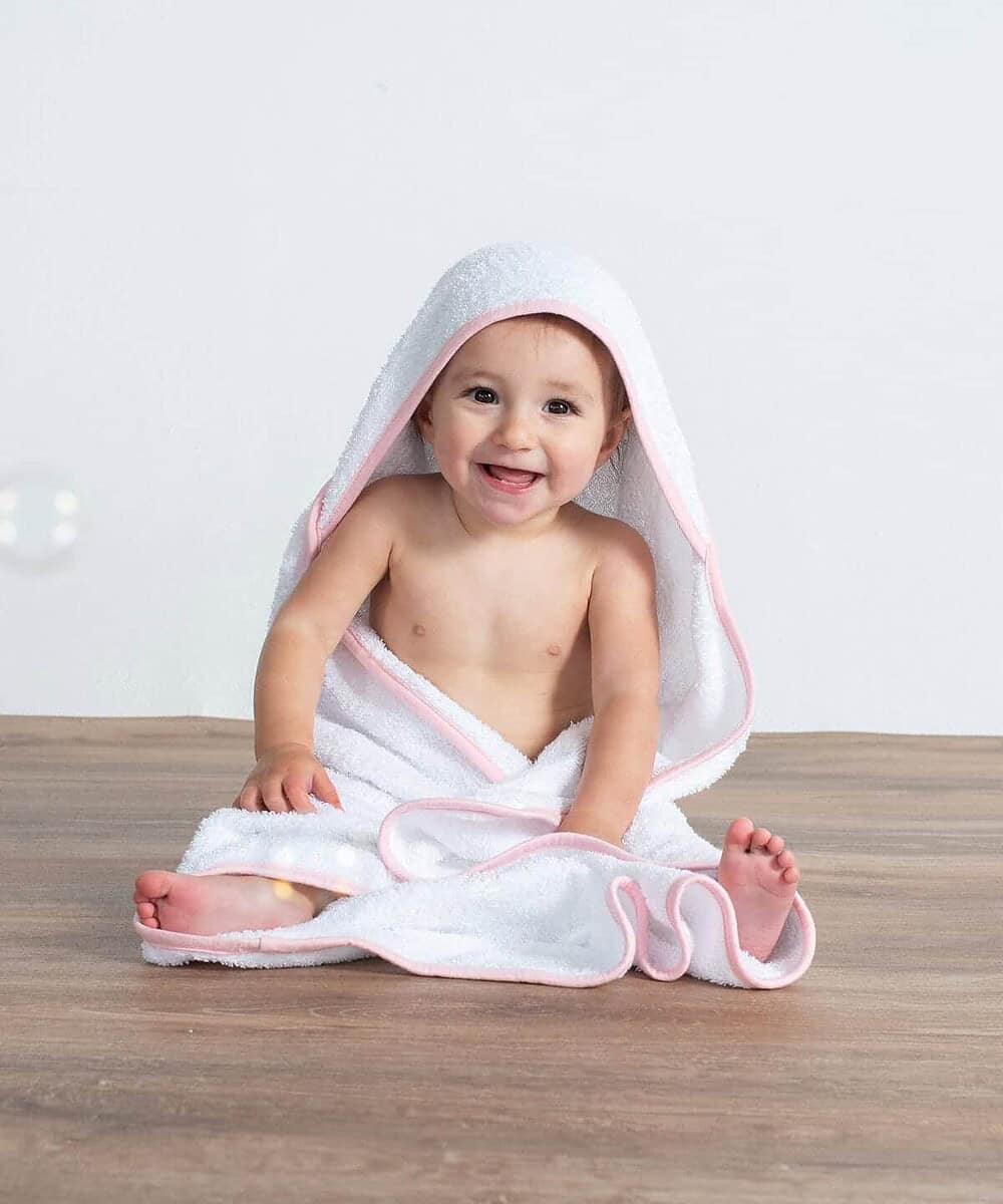 Baby hooded towel featuring soft, absorbent fabric and pink edging for comfort and style.
