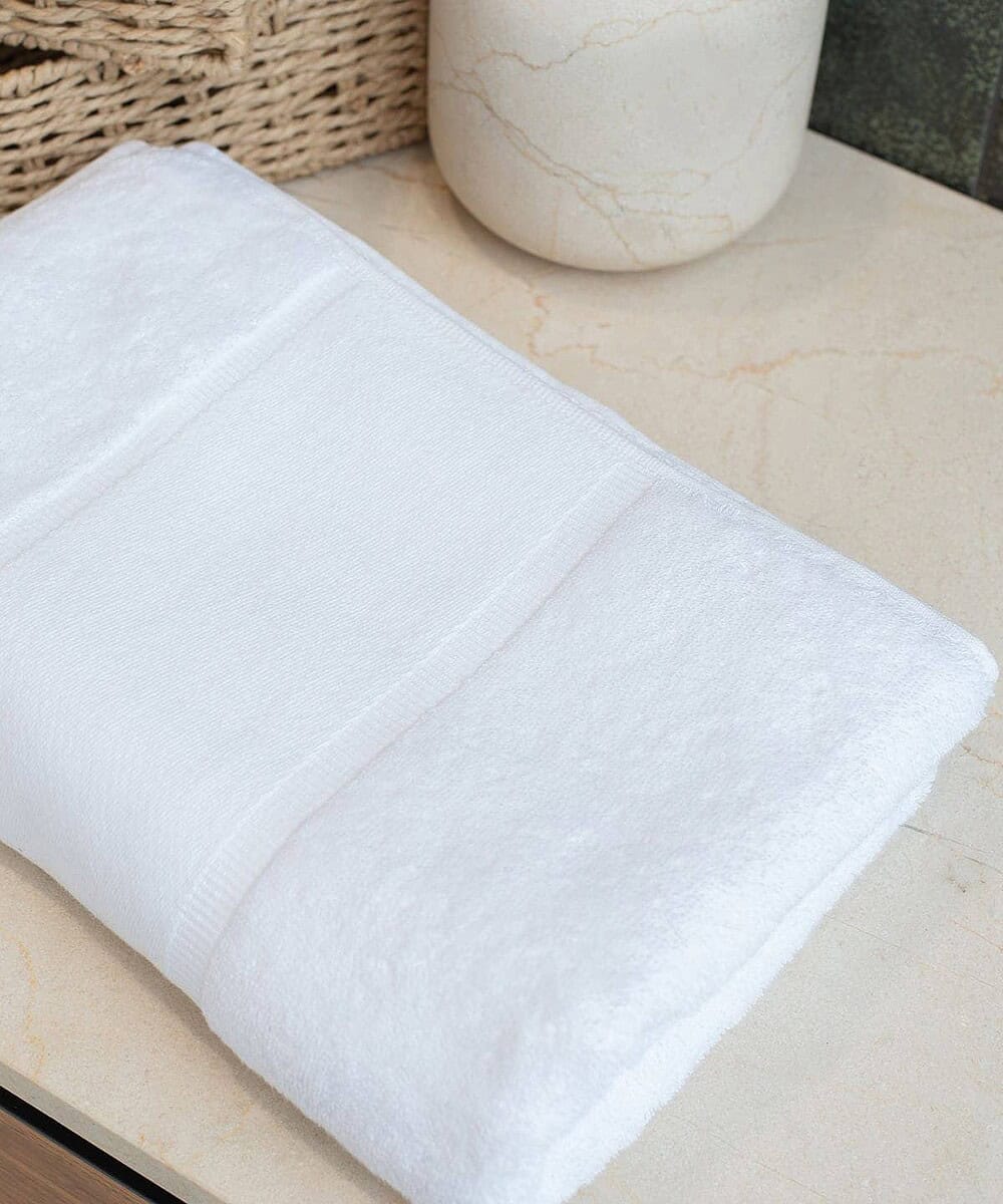 Organic bath towel with printable border for custom branding and logo display.