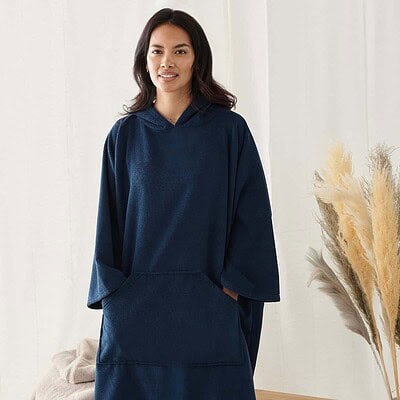 Poncho-style embroidered workwear in navy blue, ideal for branding and promotional events.