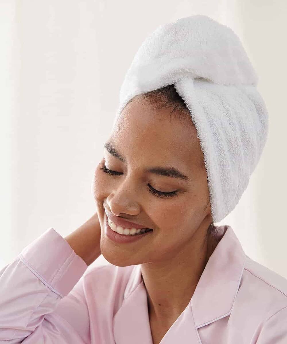 Branded hair towel with logo embroidery for salons and spas.