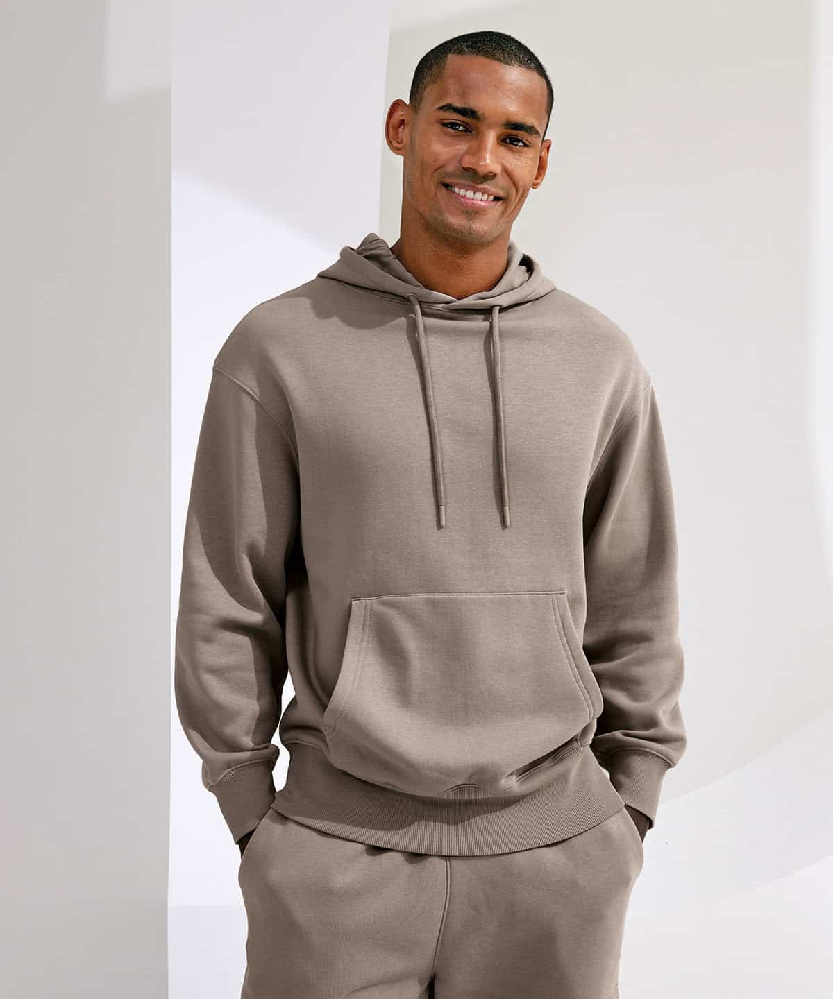 Men's beige hoodie with front pocket and drawstrings for custom embroidery and workwear.