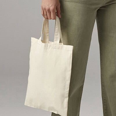 Branded tote bag with handles, perfect for promotional use and eco-friendly shopping. Custom logo pr.