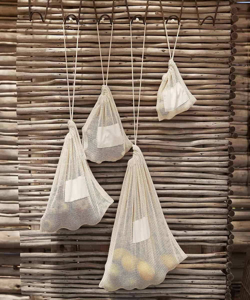 Reusable mesh cotton bags with drawstrings for custom logo printing.