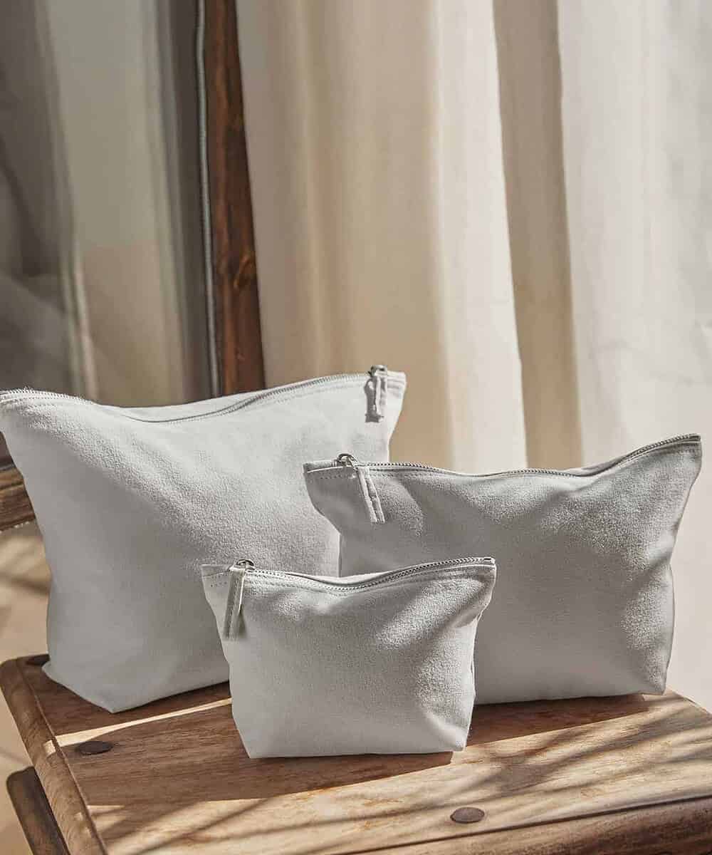 Embossed logo on a stylish white canvas accessory bag, perfect for branding and organisation.