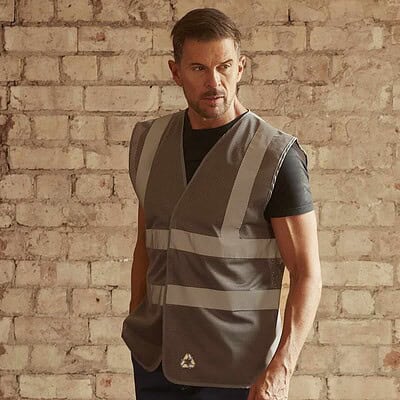 High-visibility safety vest featuring reflective stripes and space for custom branding. Ideal for wo.