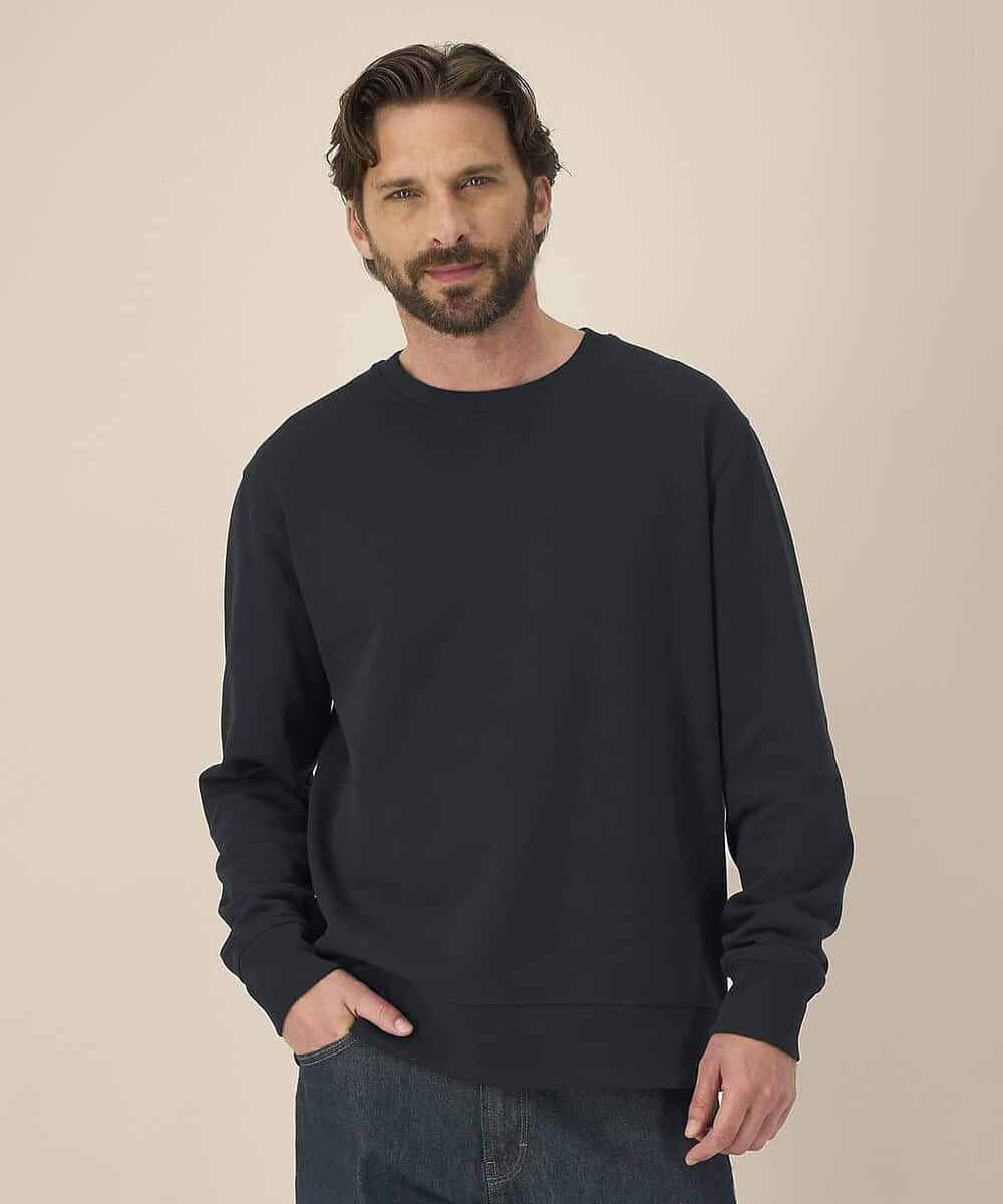 Unisex black sweatshirt from Stanley/Stella, ideal for staff uniforms and teamwear.
