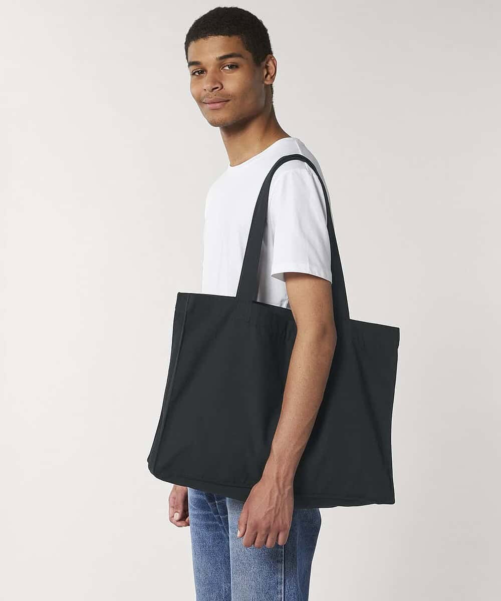 Woven shopping bag with handles, ideal for staff uniforms and teamwear. Durable and practical for re.